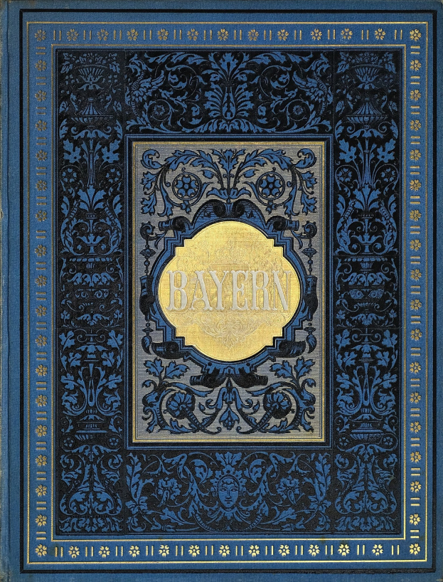 Ein blau-goldenes Buch mit der Aufschrift "Bayern" auf dem Cover, das mit detaillierten Dekorationen verziert ist.