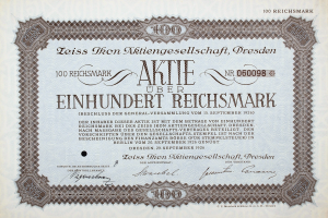 Ein altes deutsches Aktienzertifikat mit schwarzem Rand und der Aufschrift "Aktie über Einhundert Reichmark"
